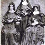 Adele Brice is standing between her first two "Postulants".