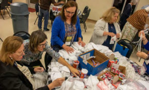 OFS members assemble backpacks for distribution to immigrants in El Paso and other border cities.