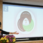 Jane , National Minister, showing presentation at the Chapter 2025