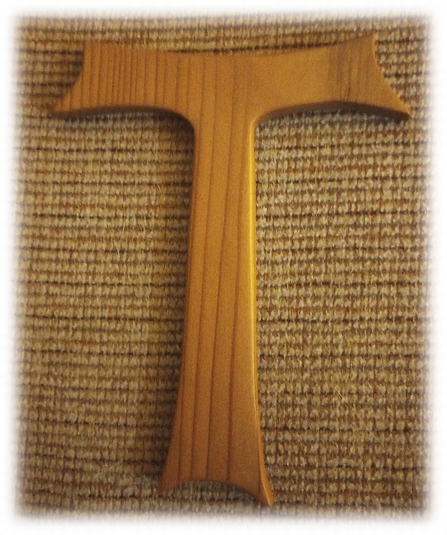 Tau Cross on a burlap material background