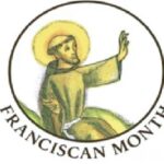 St. Francis, hand raised, sitting in a circle with Franciscan Month under the circle