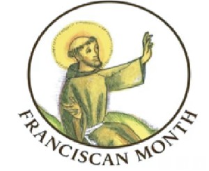 St. Francis, hand raised, sitting in a circle with Franciscan Month under the circle